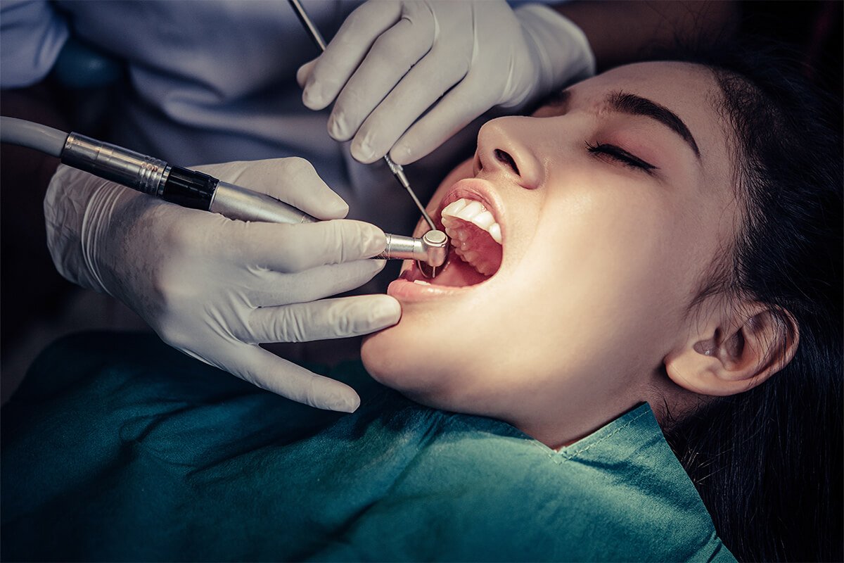 a girl getting her teeth checked